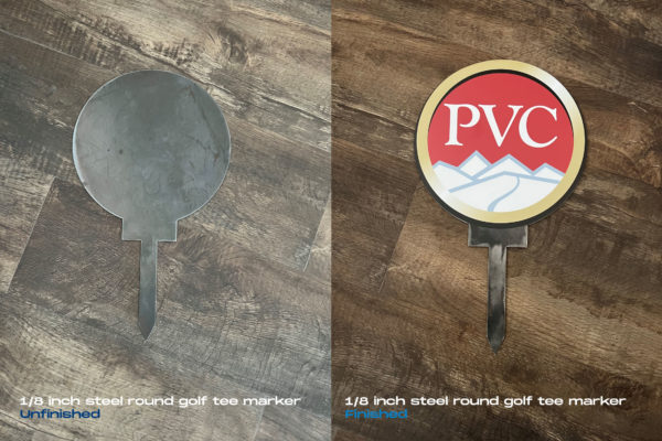 Round golf markers made from laser-cut steel.
